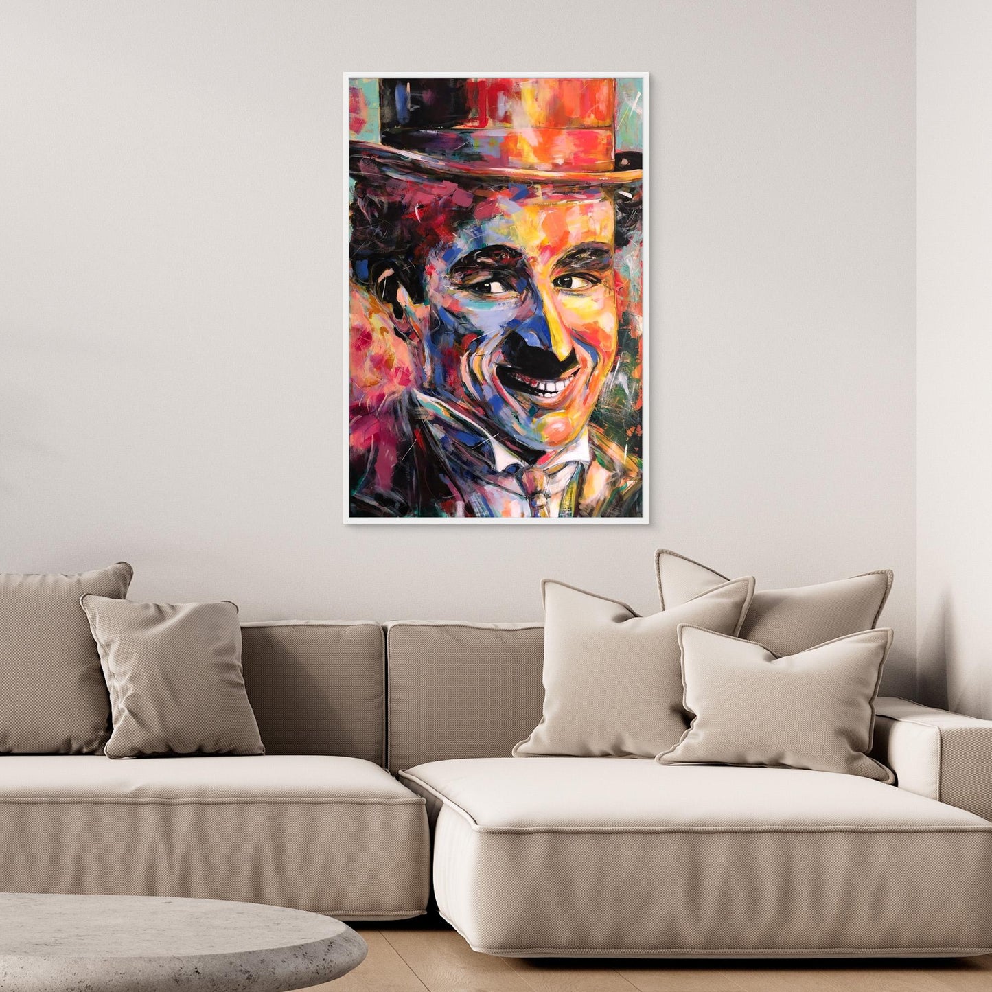 CHARLIE CHAPLIN canvas print mounted above beige sofa in living room