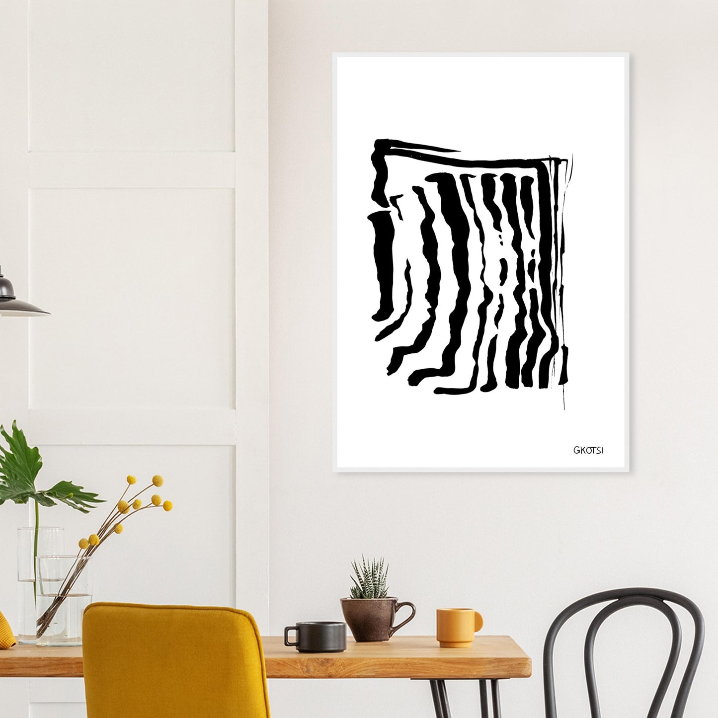 ADAPTING poster print above breakfast table in dining area