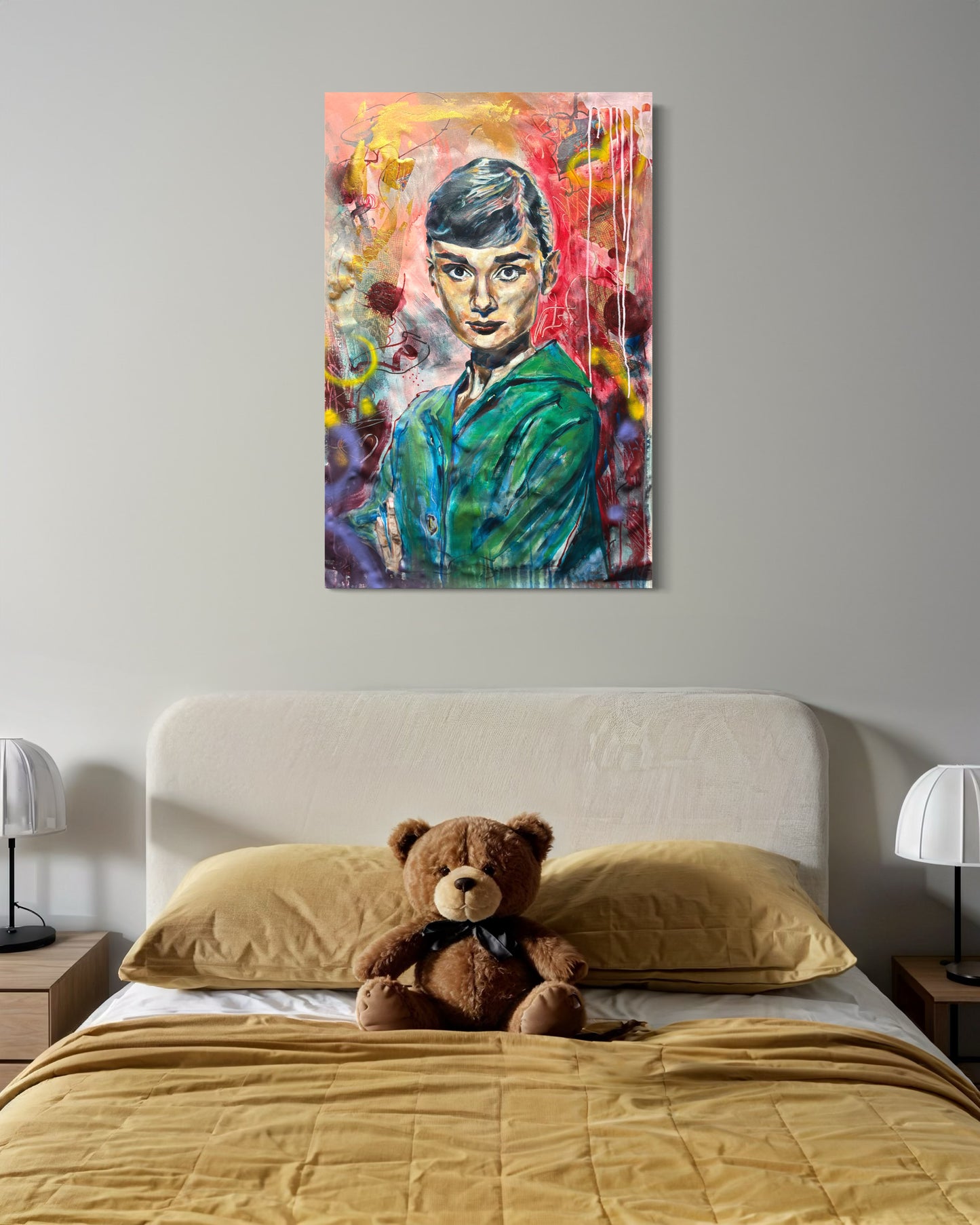 Audrey Hepburn painting above bed with teddybear