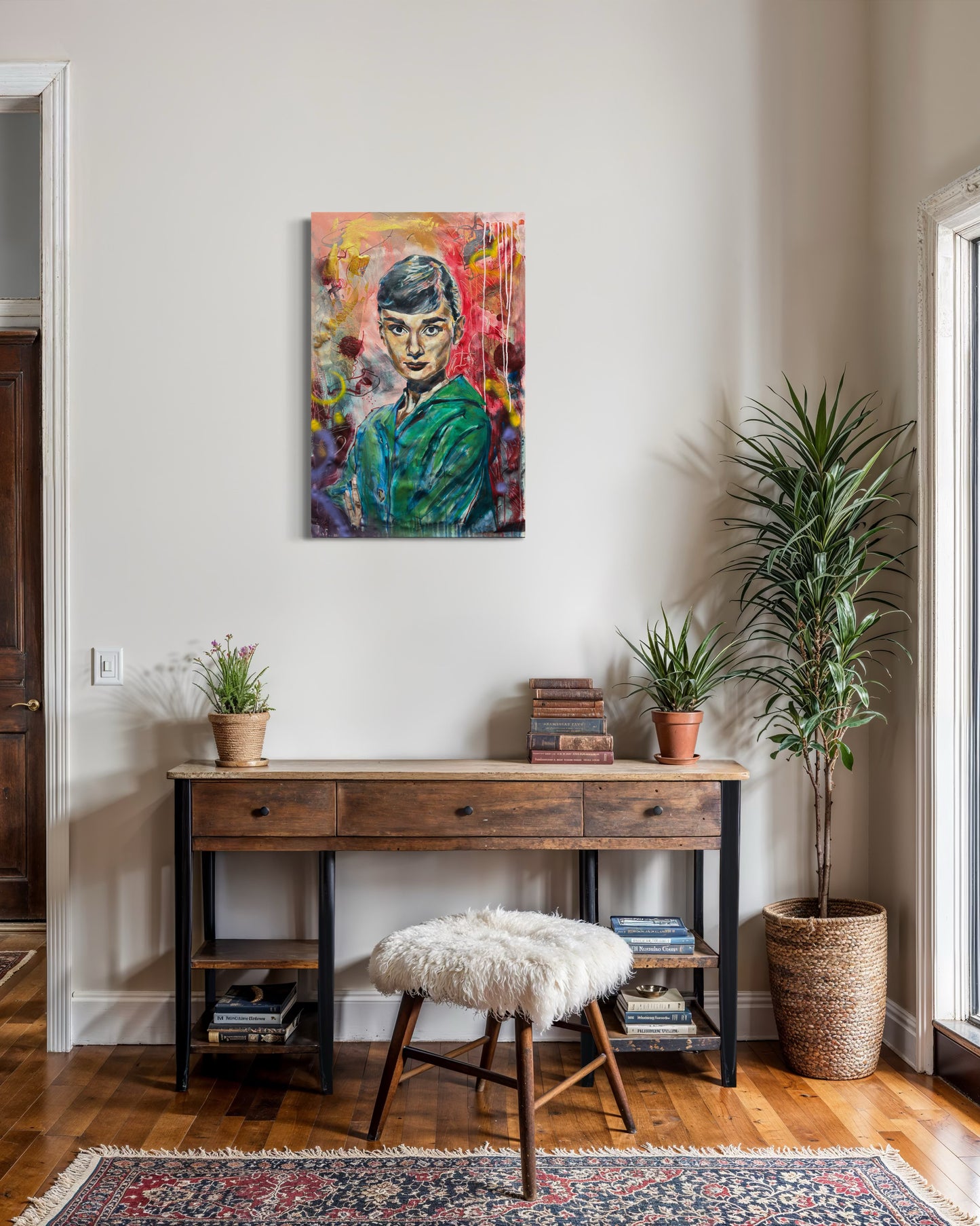 Audrey Hepburn artwork above old wooden desk