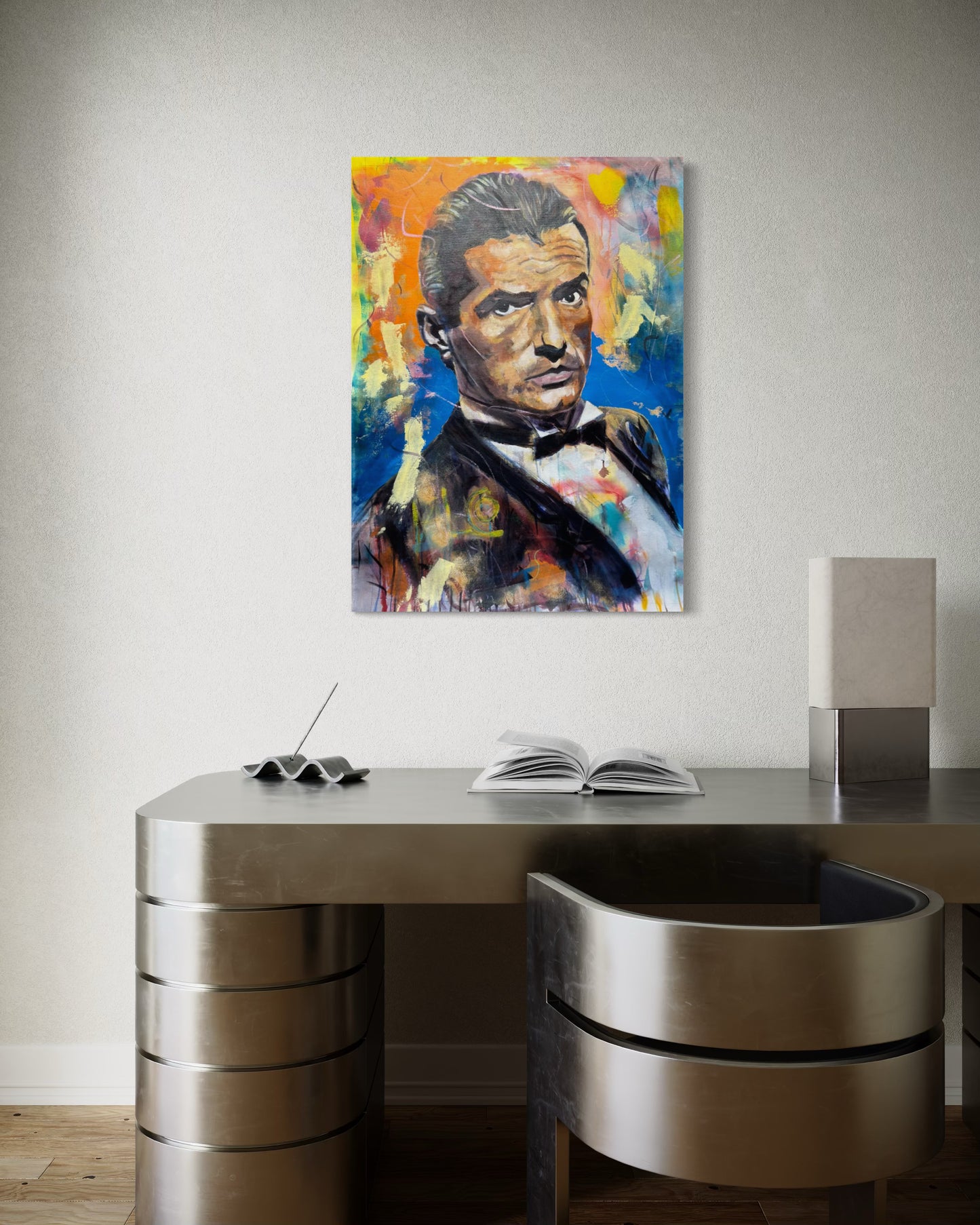 Falco portrait painting above aluminum office desk with aluminum chair