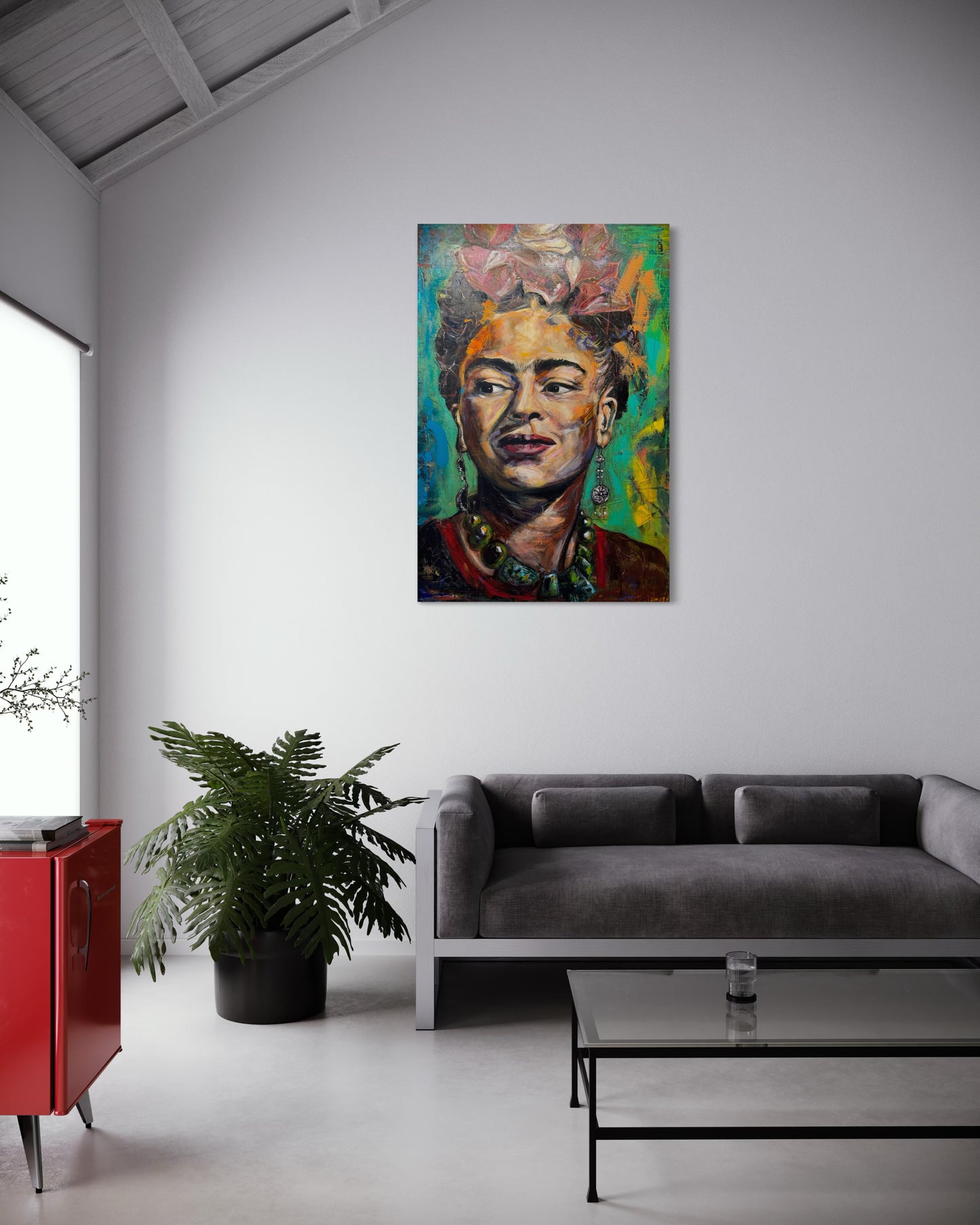 Frida Kahlo painting in roof living room with gray couch