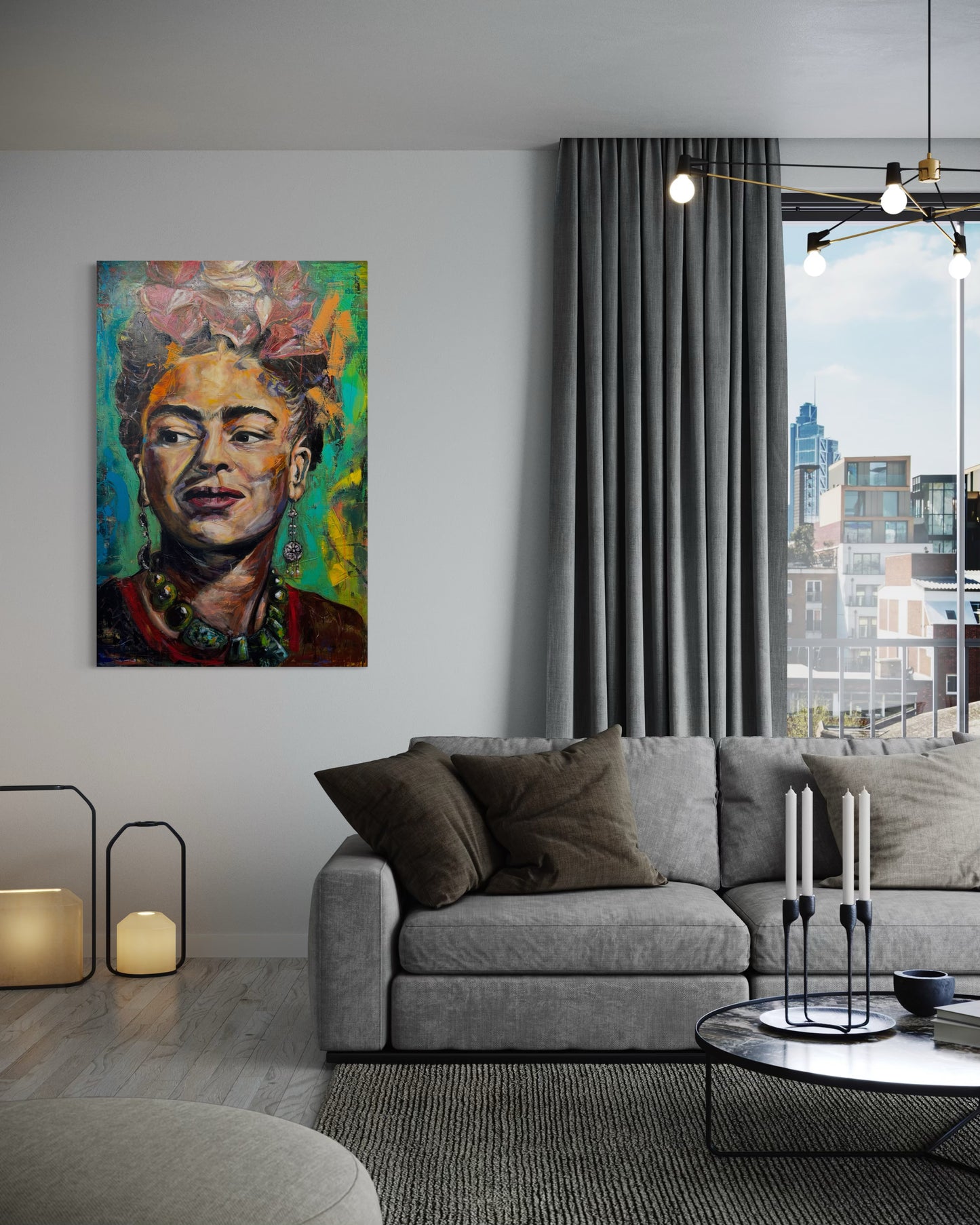 Frida Kahlo painting in living room with gray couch and candles