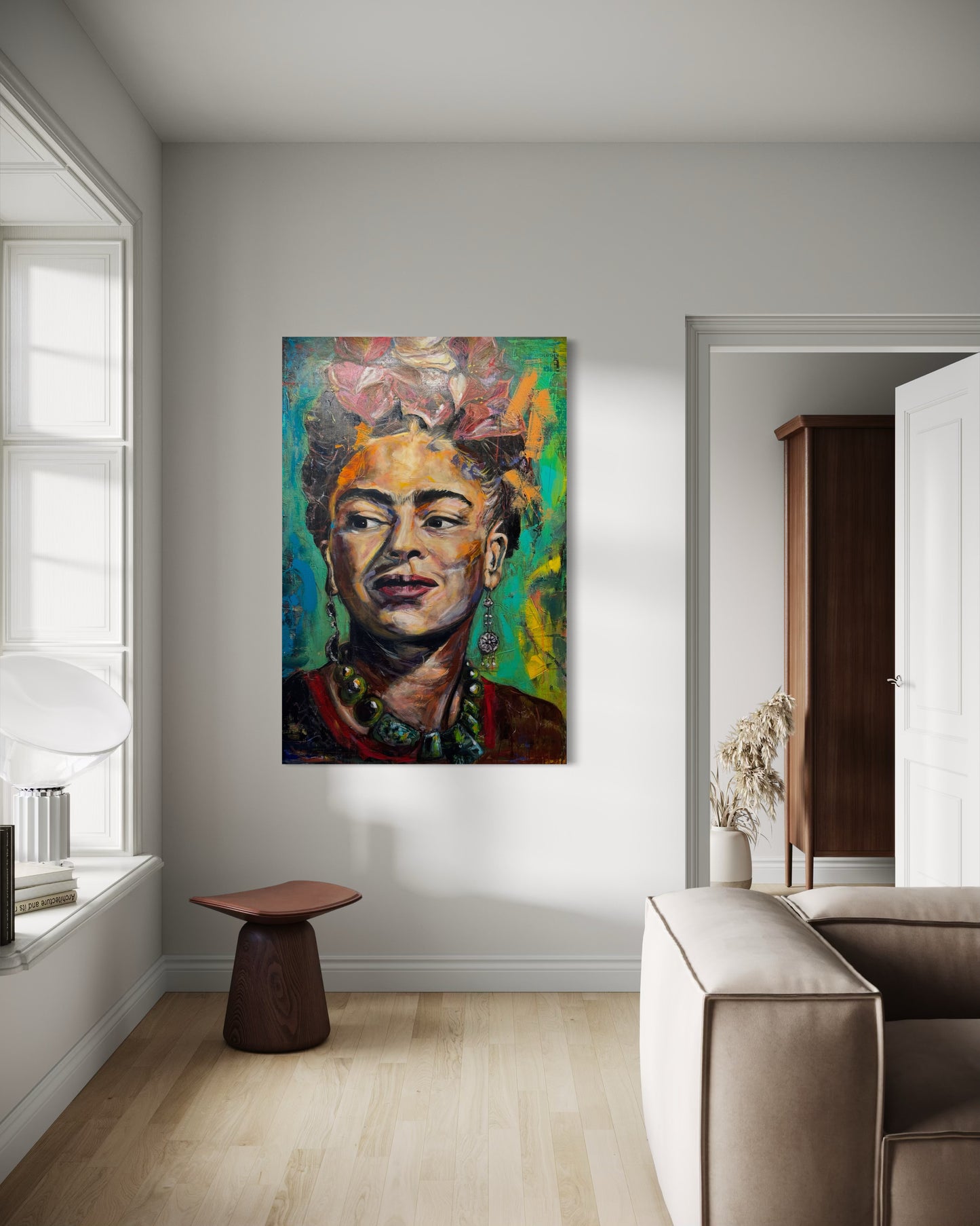 Frida Kahlo painting next to window with sofa