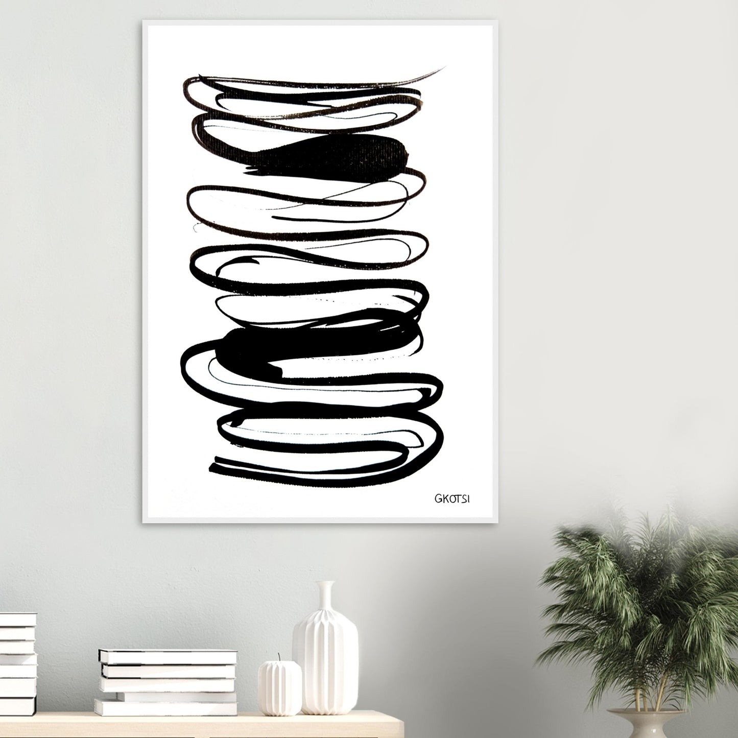 IN FLOW poster print above table with small plant