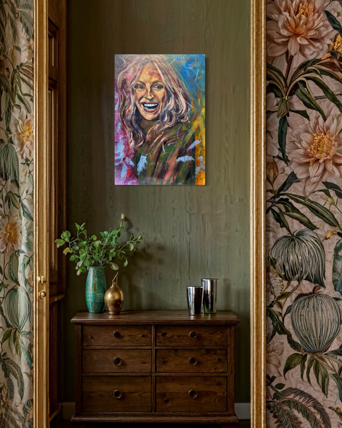 Julia Roberts Painting above small wooden dresser with flower vase