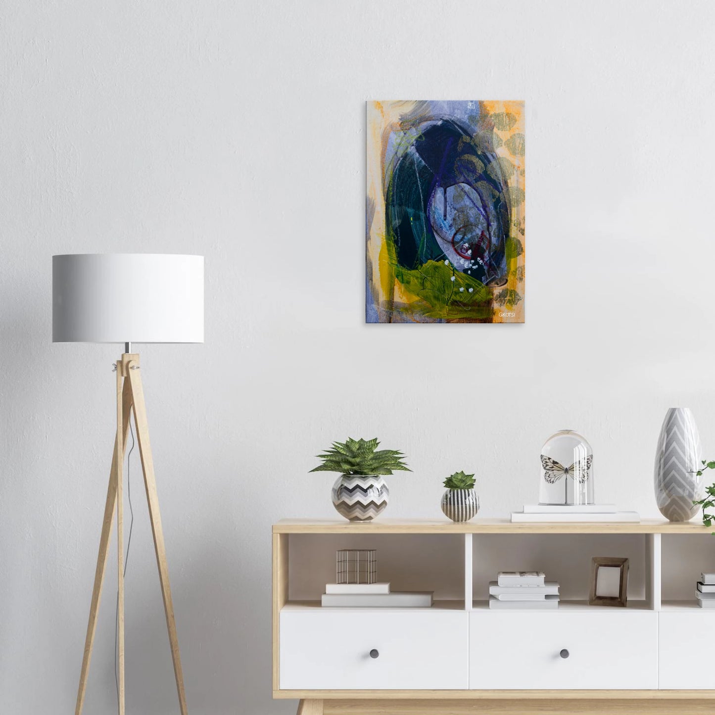 LIGHTLY canvas print above white dresser with small plant
