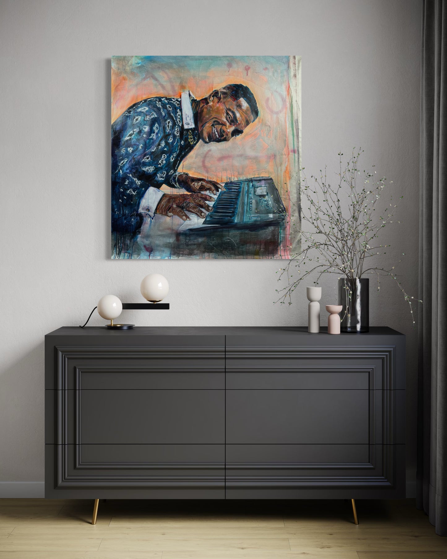 Manolito y su Trabuco above a gray dresser