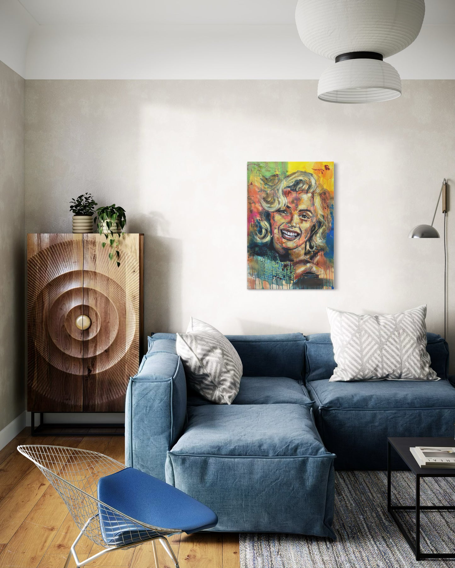 Marilyn Monroe Portrait Painting in a simple living room with blue armchair