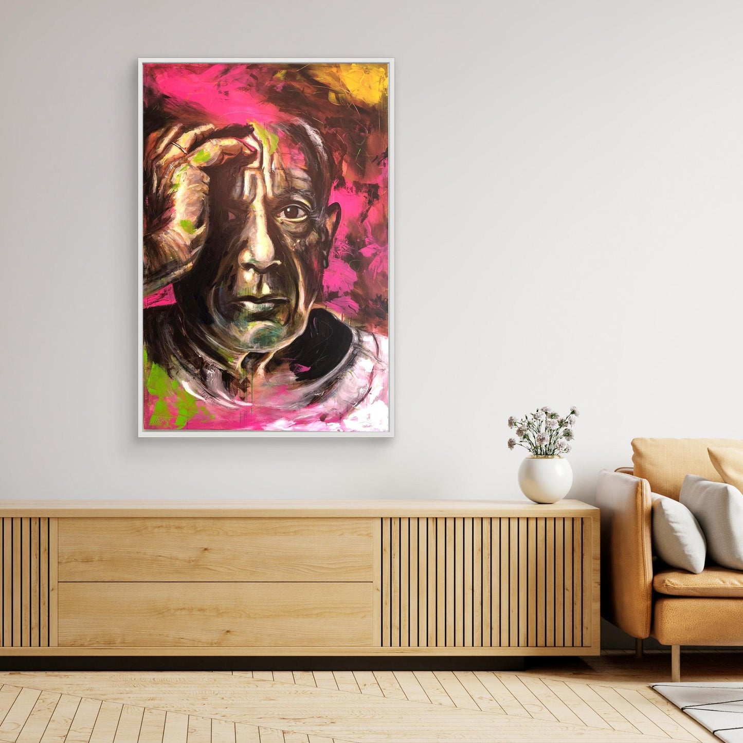 PABLO PICASSO canvas print with white frame hanging above sideboard