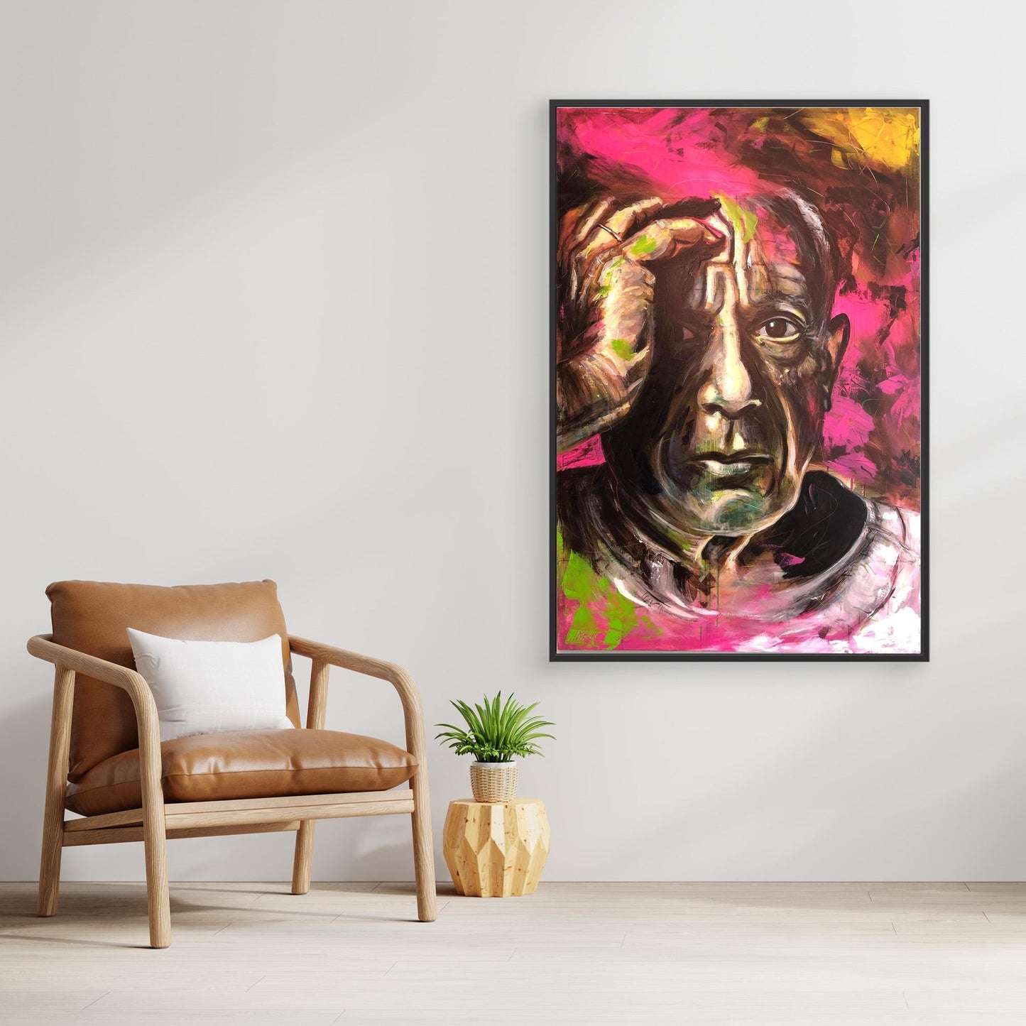 PABLO PICASSO canvas artwork displayed above chair