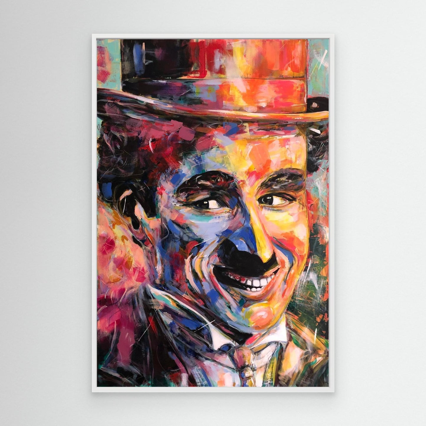 CHARLIE CHAPLIN canvas print with white frame displayed on wall