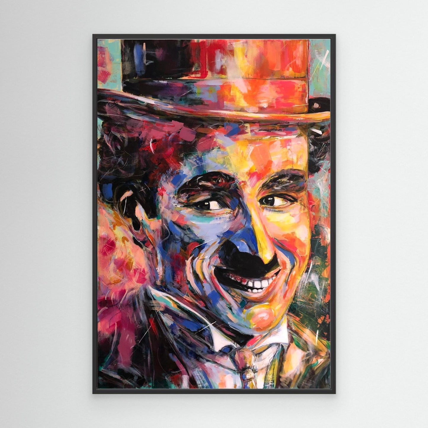 CHARLIE CHAPLIN canvas print with black frame displayed on wall