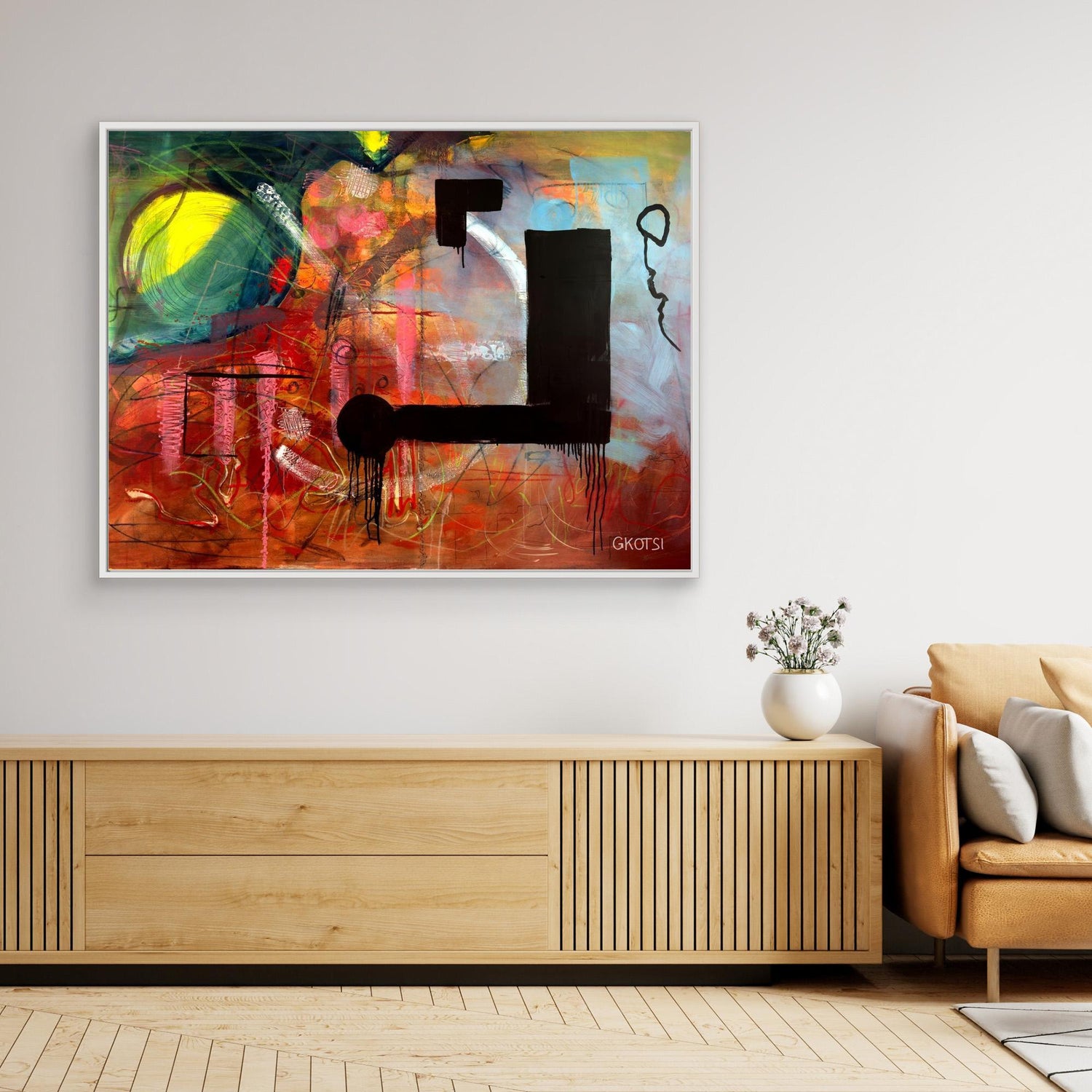 NOT ABOUT Abstract Canvas Print hanging over console table with small plant