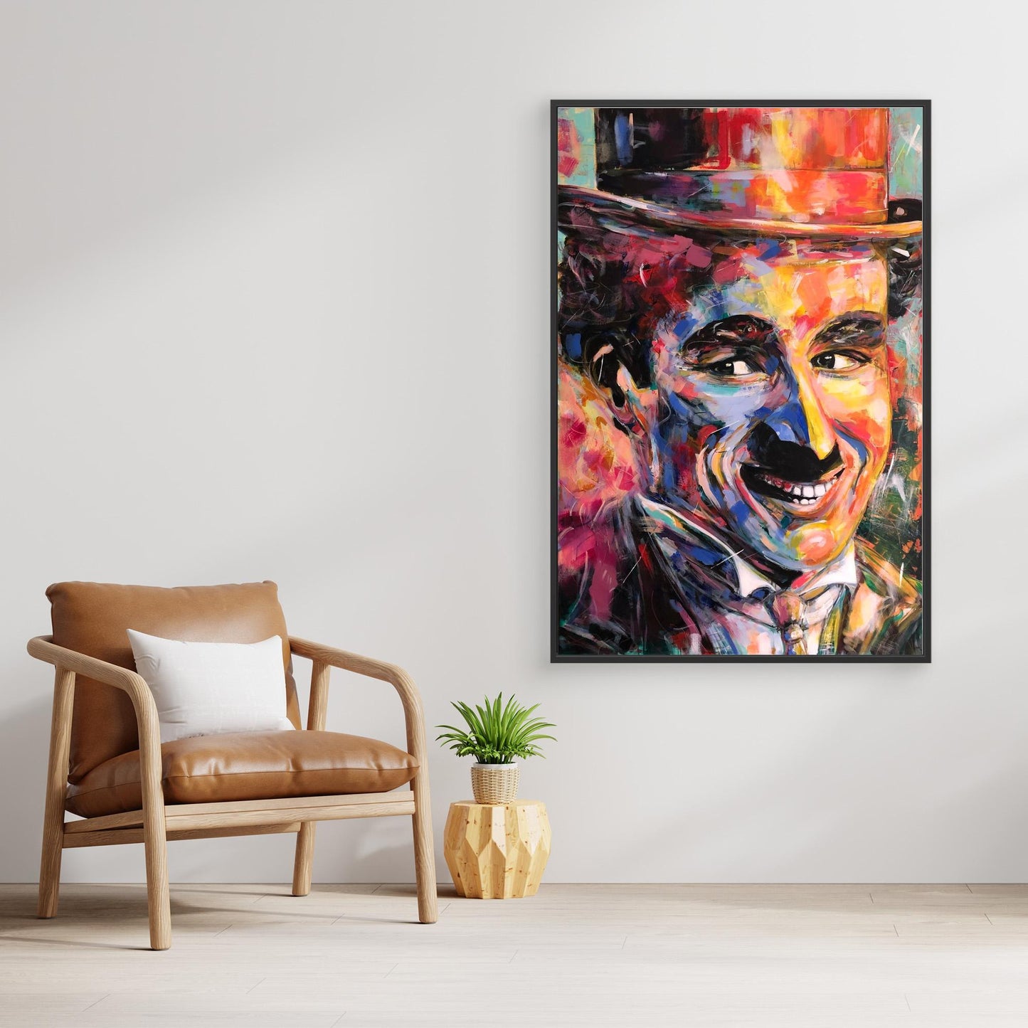 CHARLIE CHAPLIN canvas artwork displayed above stylish chair