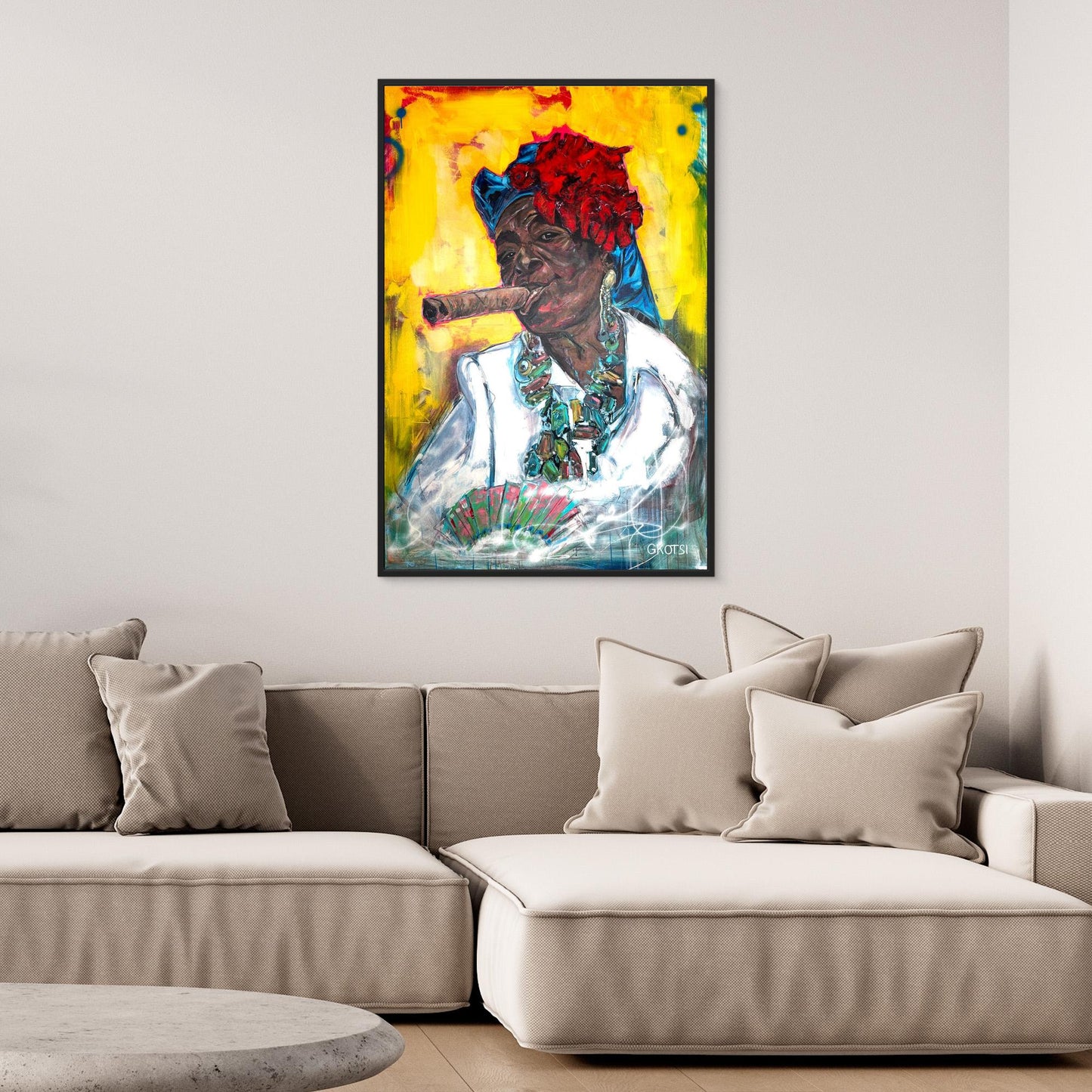 CUBAN WOMAN WITH CIGAR Portrait Canvas Print with black frame hanging above beige sofa in stylish interior setting