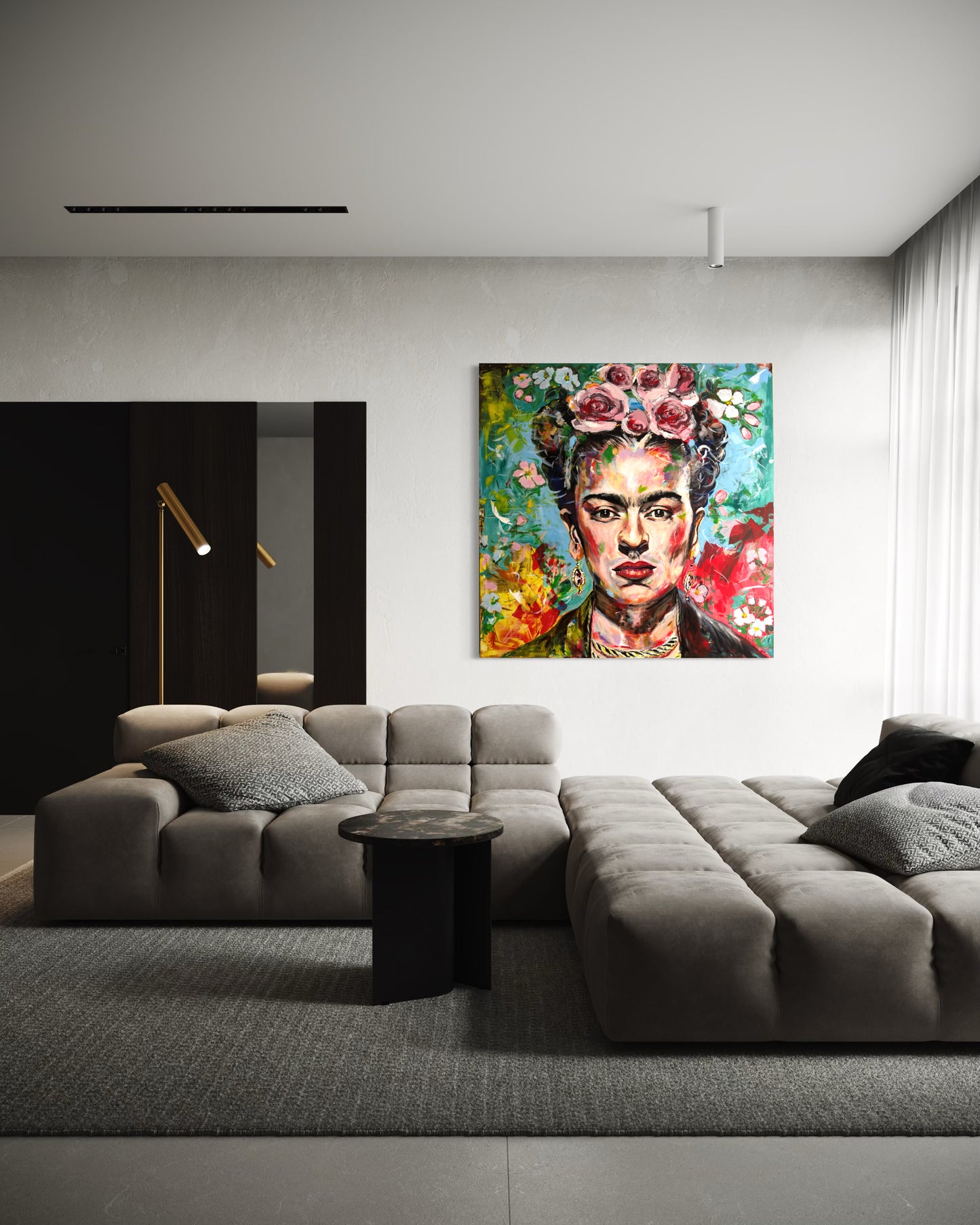 Modern living room with a gray sectional sofa and a colorful Frida Kahlo painting on the wall.