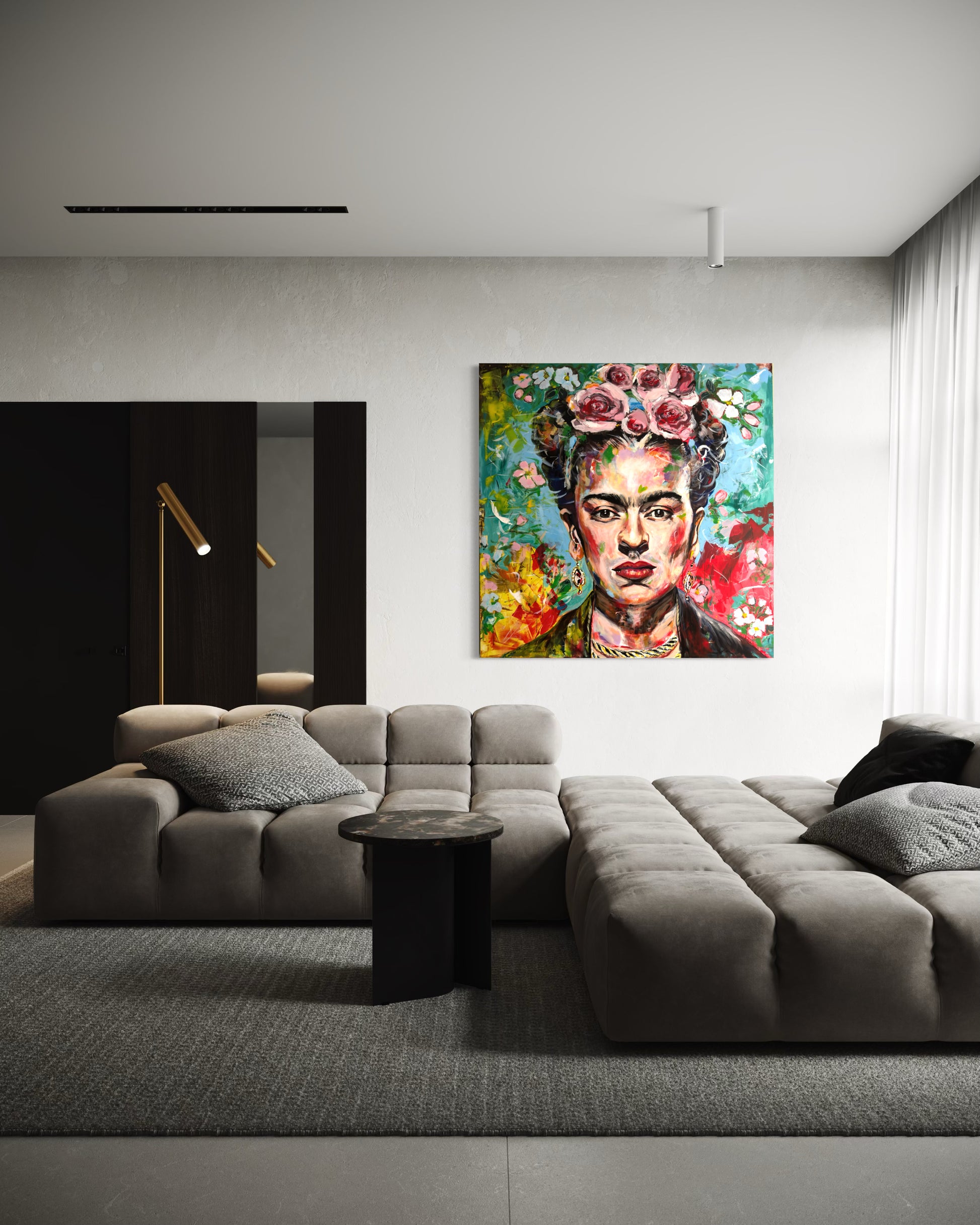 Modern living room with a gray sectional sofa and a colorful Frida Kahlo painting on the wall.