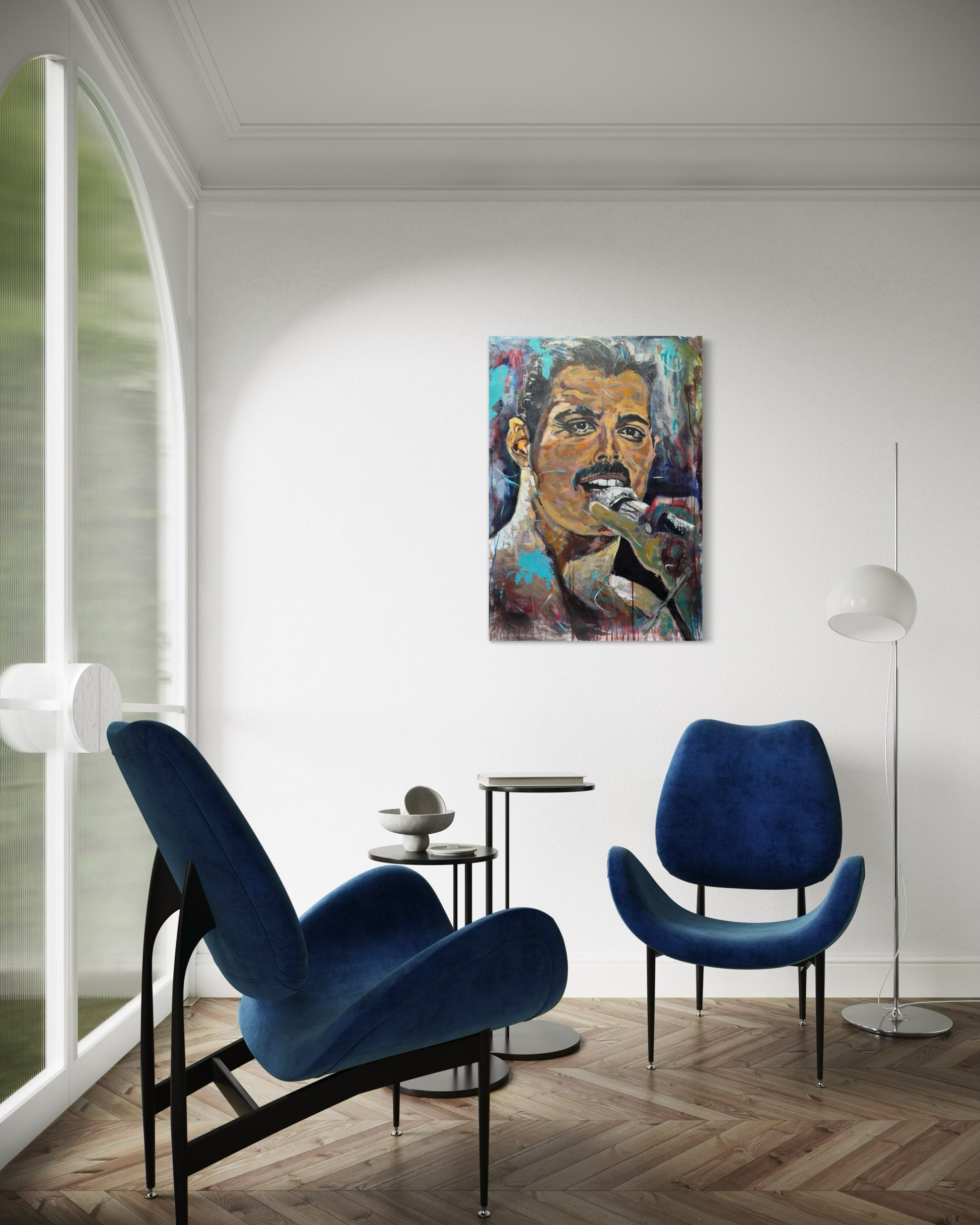 Freddie Mercury Painting in room with blue couch armchair