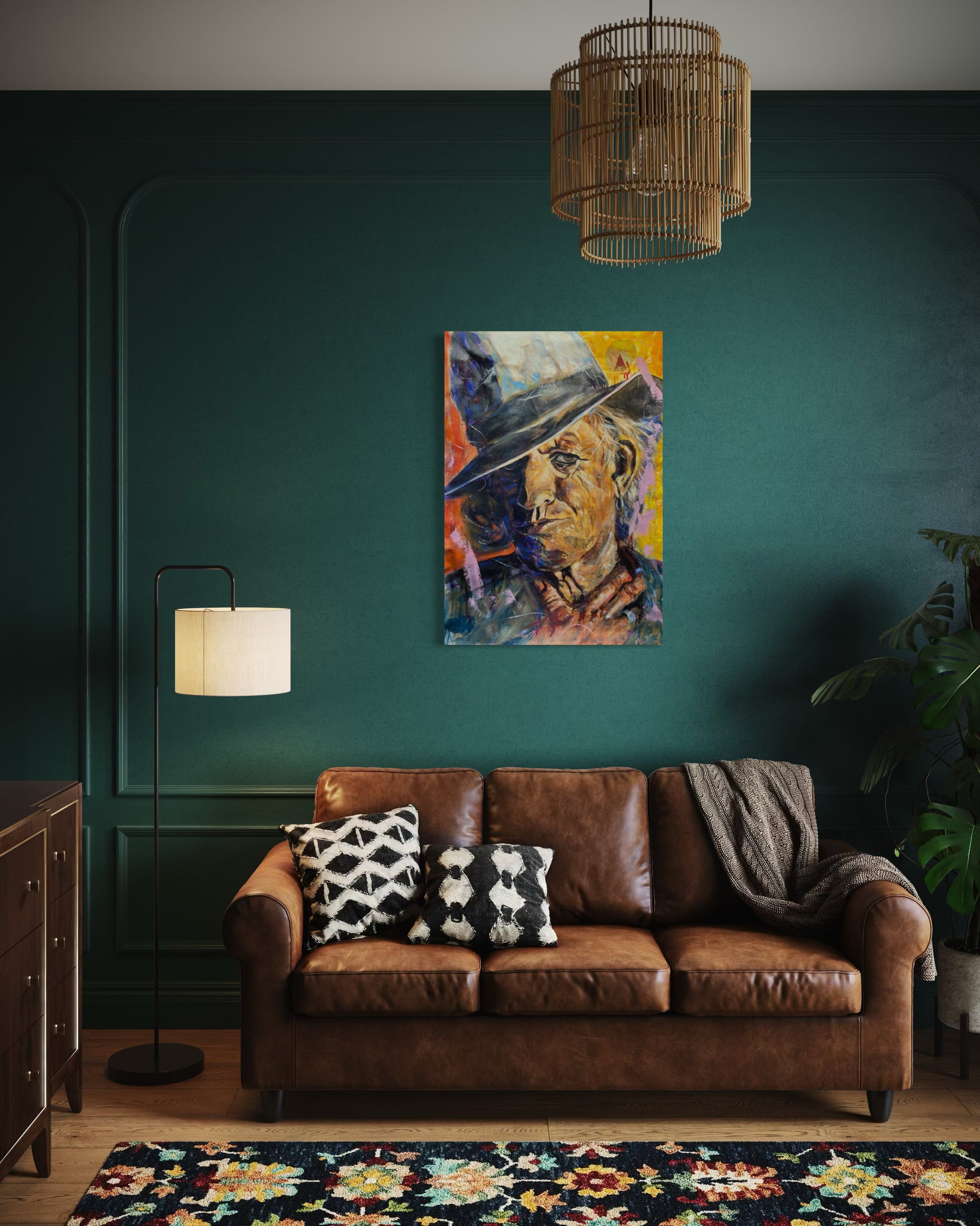 Keith Richards Painting above a leather couch with dark green wall
