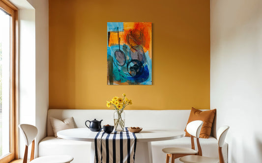 Modern living room with a colorful abstract painting on an orange wall, white sofa, and small round table.