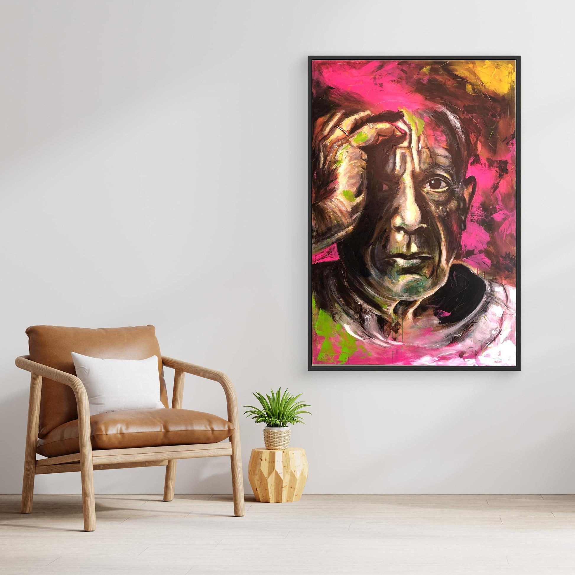 PABLO PICASSO canvas artwork displayed above chair