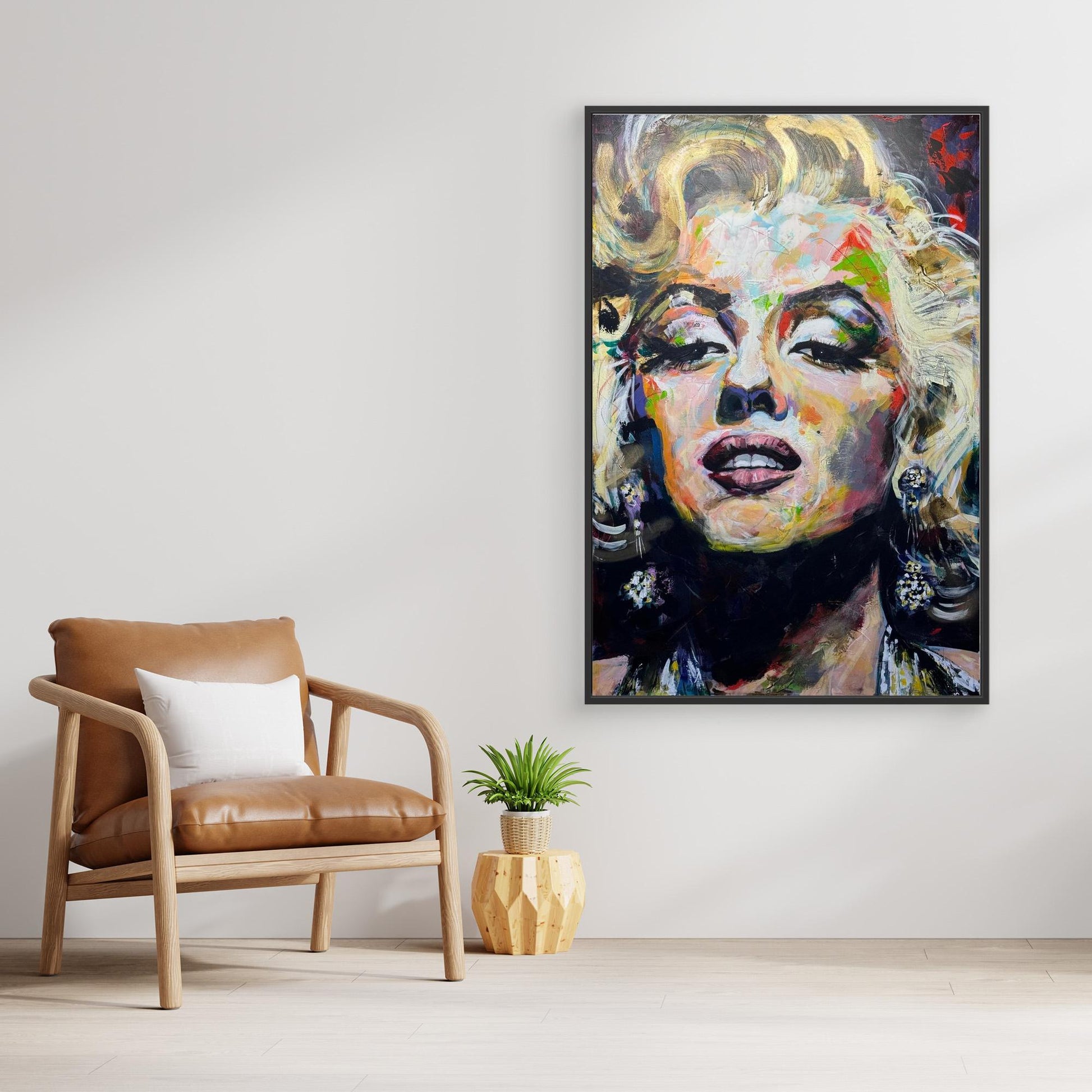 MARILYN MONROE 1 canvas print with black frame displayed above stylish chair
