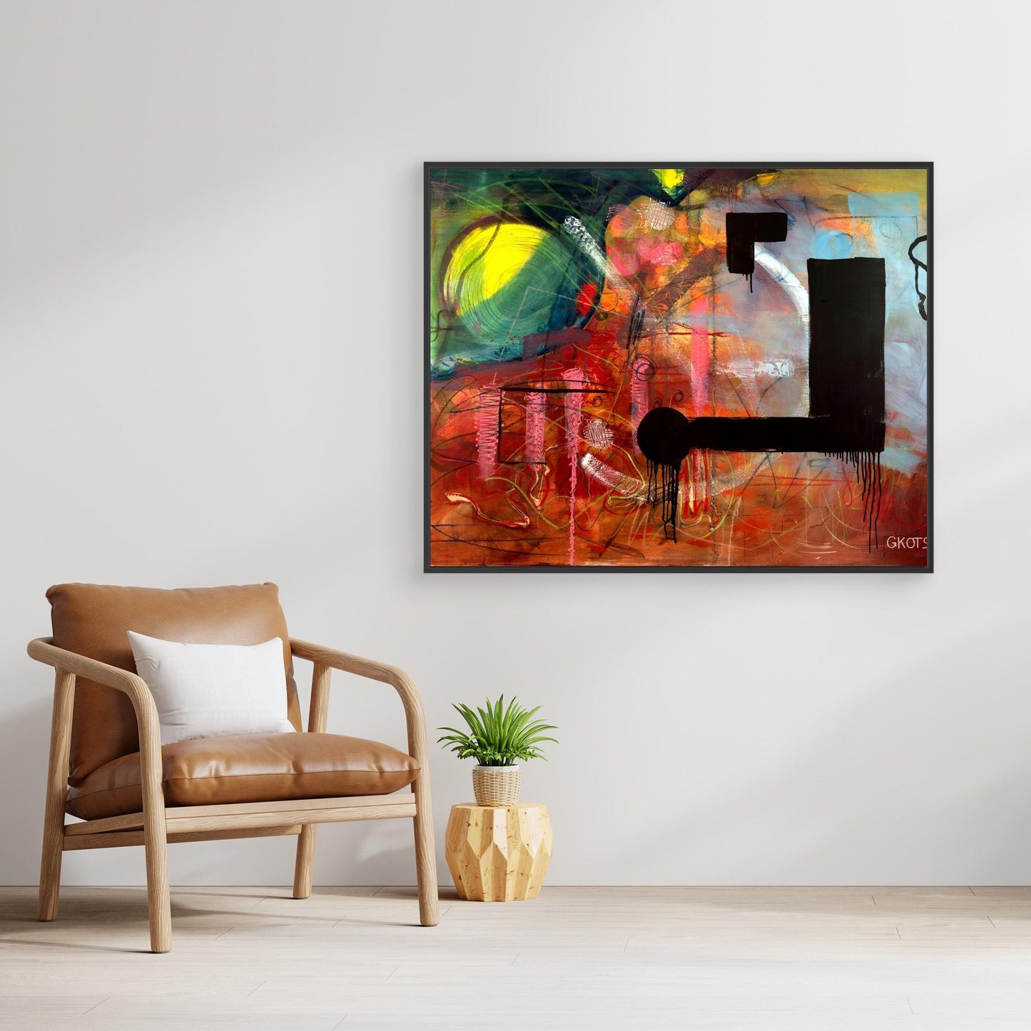 NOT ABOUT Abstract Canvas Print hanging over small plant and contemporary chair in scandinavian style room